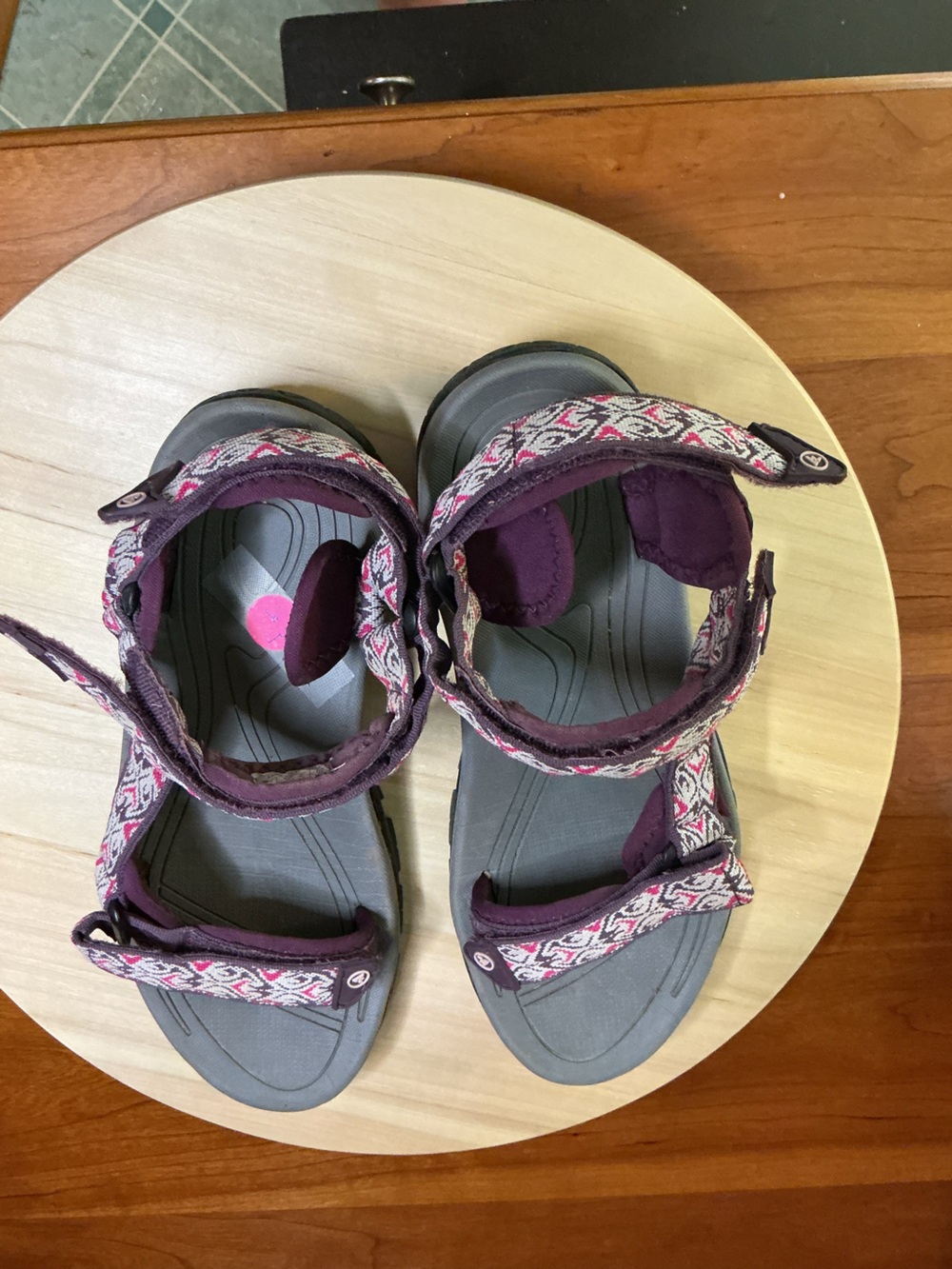 Atika Walking sandals with grey sole and a purple patterned strap design.